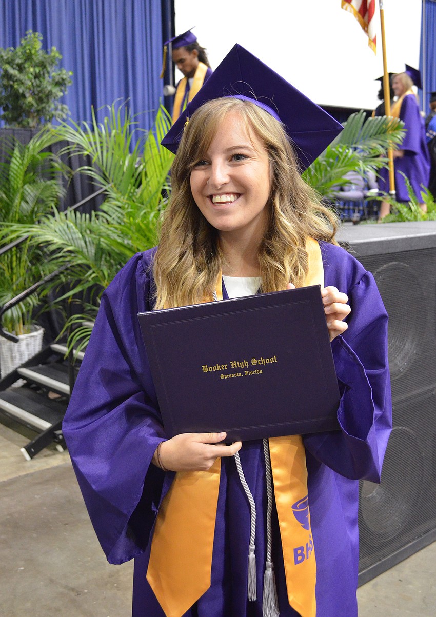 Taylor Horner poses with her new diploma