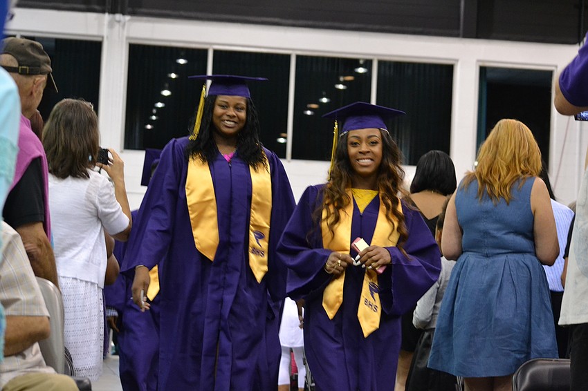 Students walk in to Robarts Arena for the commencement ceremony.