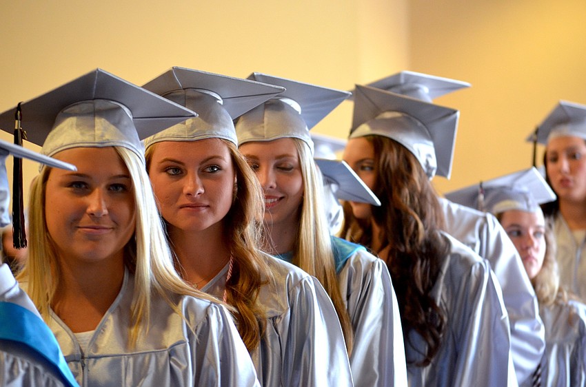 Top four and top 10 students are showcased by their robe color.
