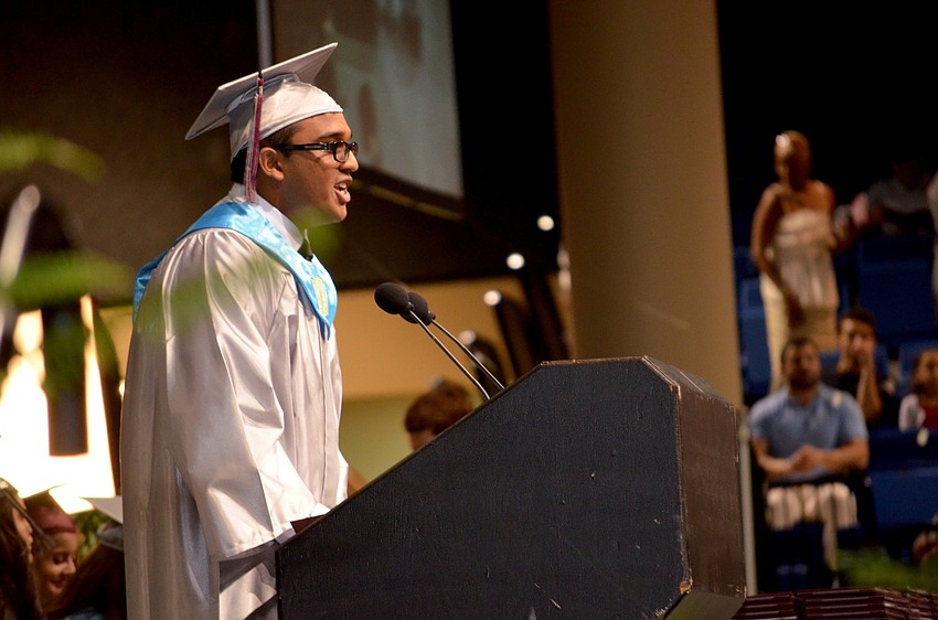 Zachary Ali delivers a welcome speech.