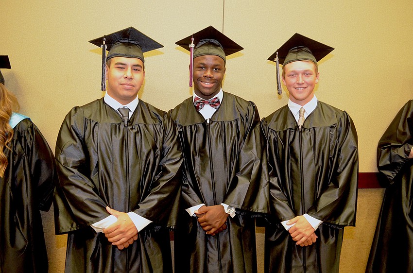 Christian Gutierrez, Jarick Hamilton and Andrew Hammett wait for their chances to cross the stage.