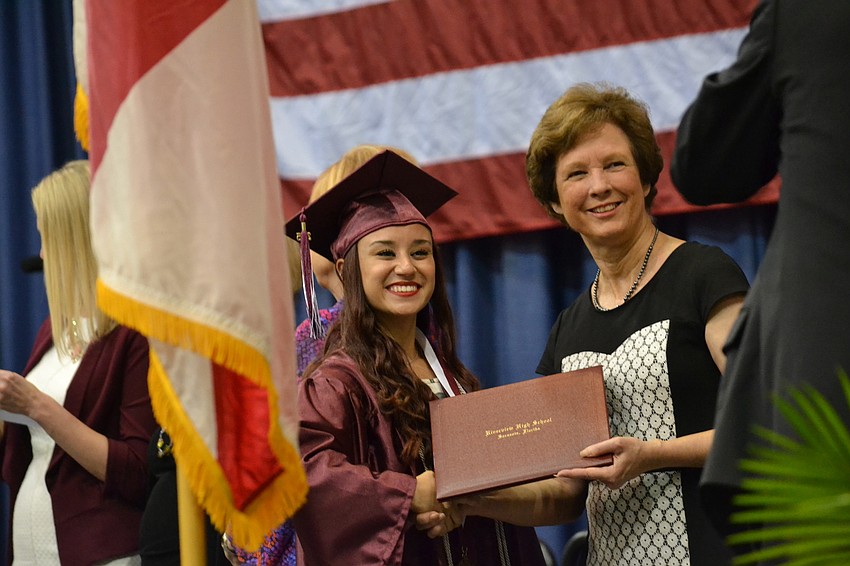 Alicia Ramirez receives his diploma from Superintendant Lori White.