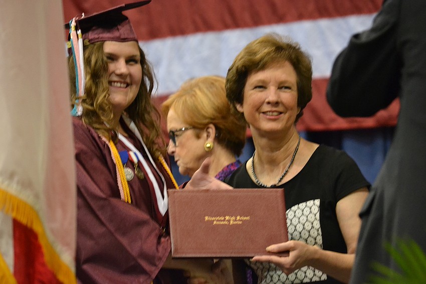 Jasmine Ridge poses for a photo with Superintendant Lori White.