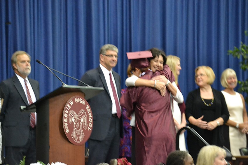 Lindsay Claydon hugs Principal Linda Nook.