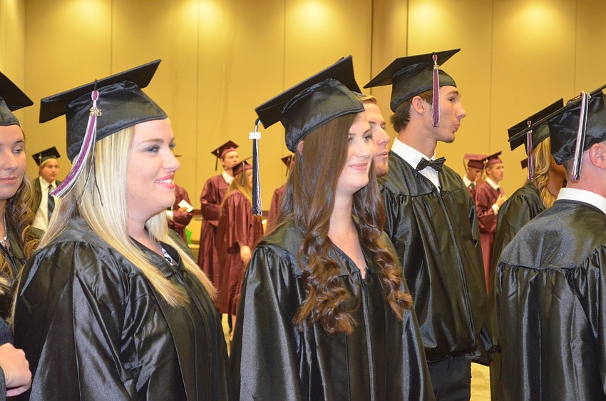 Seniors chat and wait for the ceremony to start.