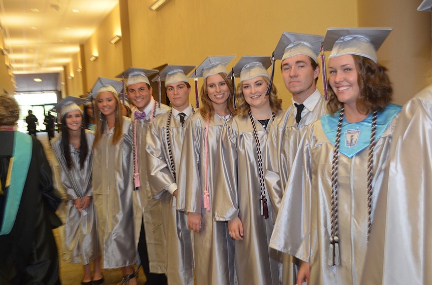 Students in the top four and top 10 percentiles marched into the auditorium first.
