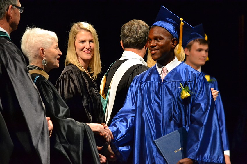 Sarasota County School Board Member Caroline Zucker congratulates Christopher Blake.