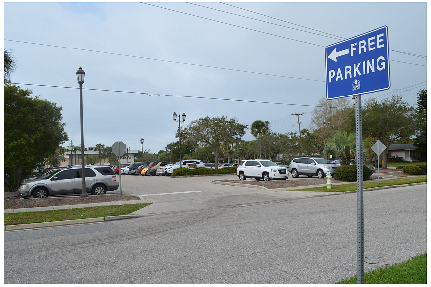 The city is investigating its options for constructing a parking garage on what is currently a surface lot on North Adams Drive.