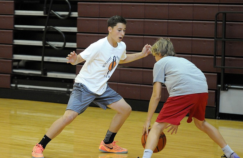 Matteo Catena, 13, participates in a defensive drill during Riverview High’s basketball camp.