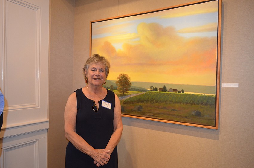 Artist Susan Covert with her “Morning Over Keuka Lake”
