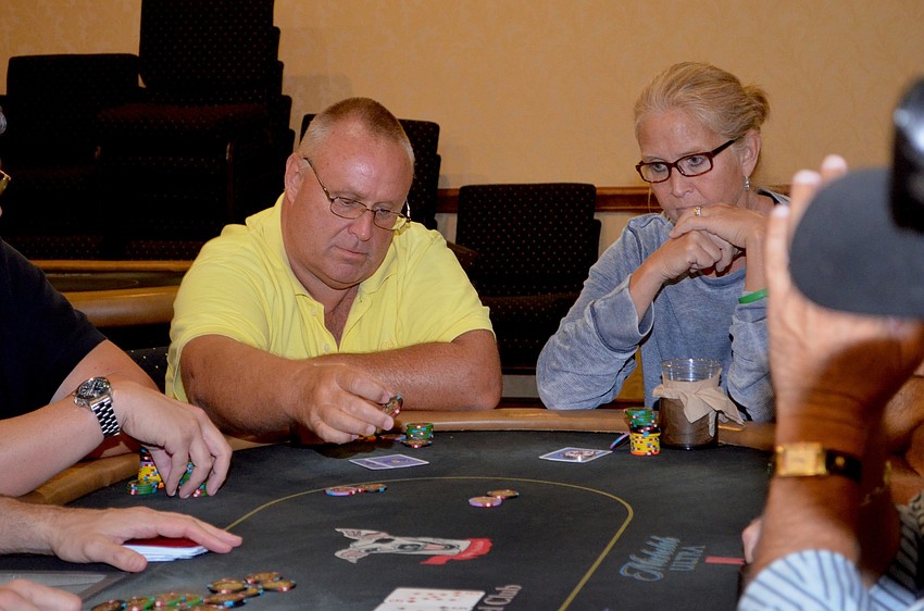 Dave Barnes and Jody Rajcula focus on a tough poker round.