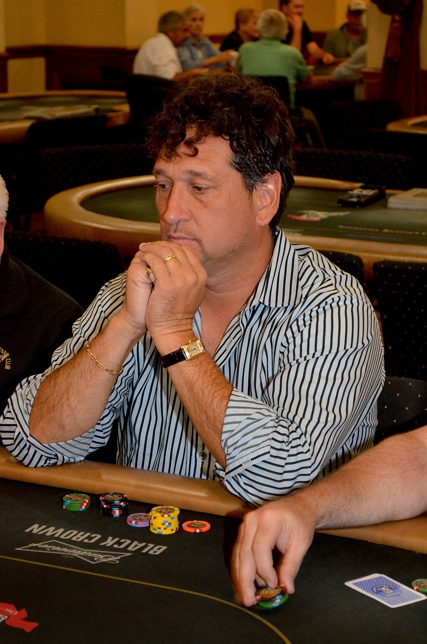 Greg Bever decides on his next move during a poker game.