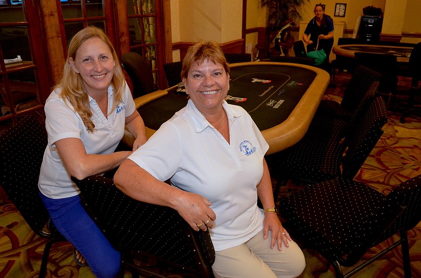 Terri Schubel and Debra Lynn-Schmitz, of the Siesta Key Chamber of Commerce, relax after dinner and cocktails are served.