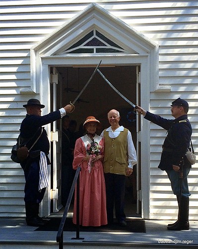 Soldiers hold swords above the heads of Babe and Jim Reger, as they leave the church as husband and wife. Courtesy photo