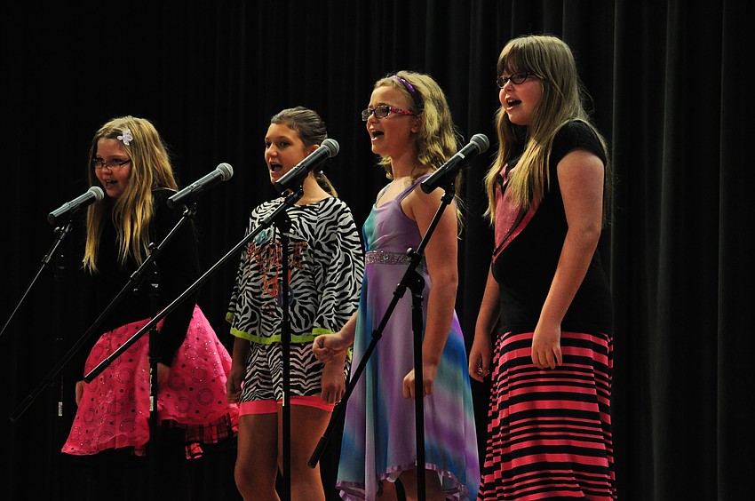 Sophia Parry, Olivia Sahr, Ally Adamo and Grace Parry perform “We Go Together” for the crowd.