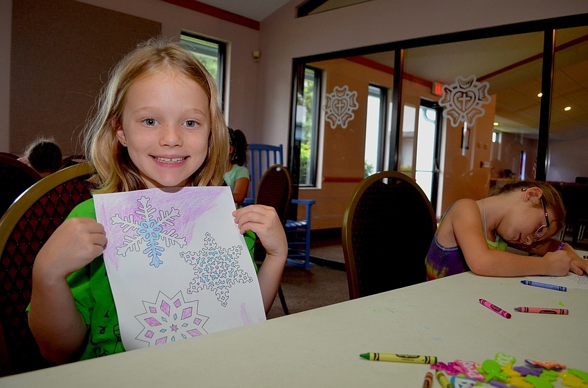 Emma Schwarzbauer practices coloring in and out of the lines.