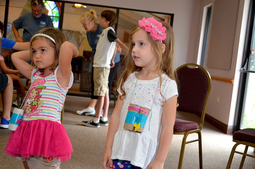 Sisters Kiley and Julie Mulligan play Simon Says.
