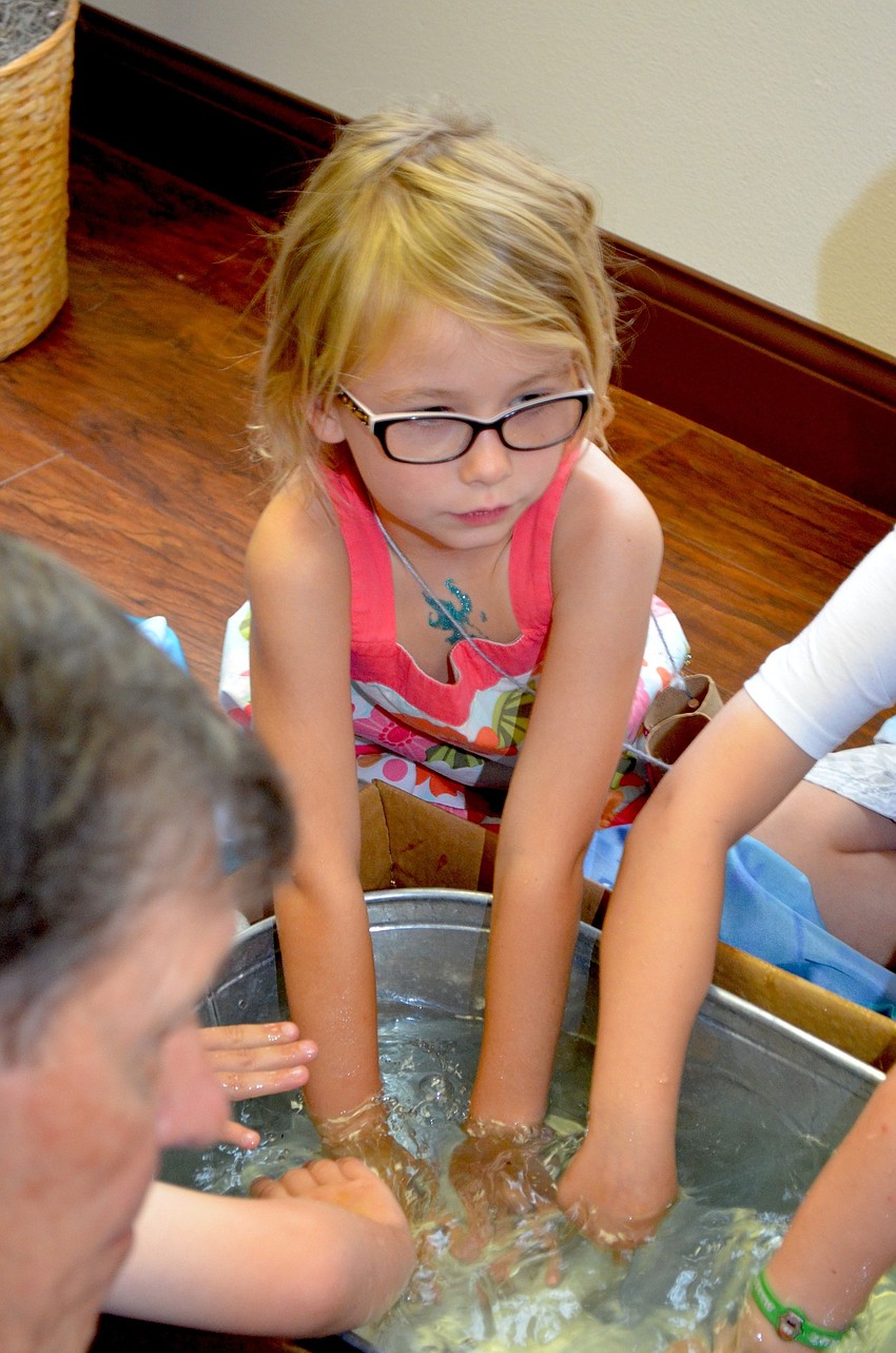 Madalyn Miles dives in to a water activity.
