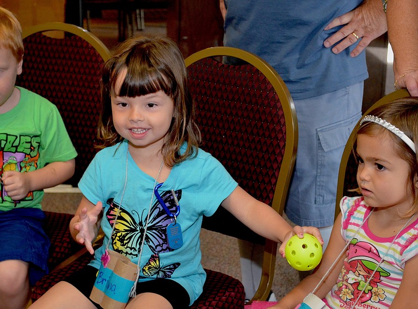 Campers ages 3 to 11 play Hot Potato and other games.