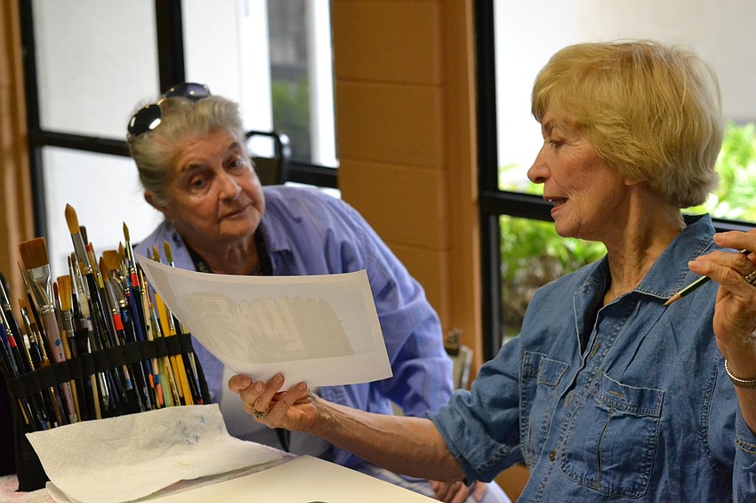 Beverly Peysbr and Carol Marcus swap ideas before starting their watercolor pieces.