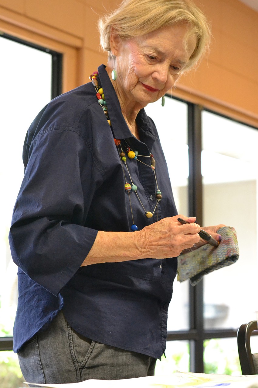 Penny Hendry starts her painting of a bird of paradise.