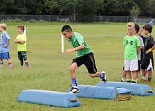 Nine-year-old Lane Tomlinson enjoyed participating in a series of tackling drills.