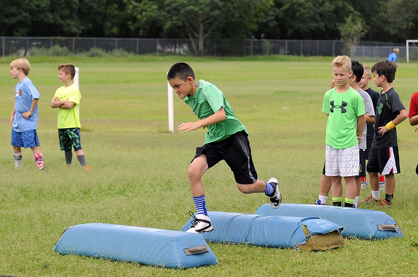 Nine-year-old Lane Tomlinson enjoyed participating in a series of tackling drills.
