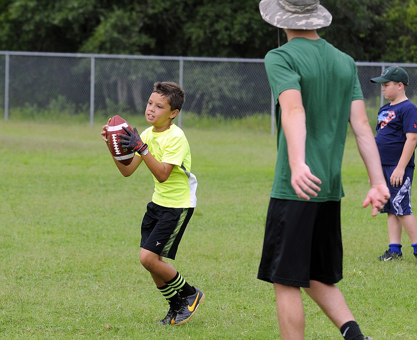 Ten-year-old Ezra Phillips’ favorite part of camp was the running back and wide receiver drills.