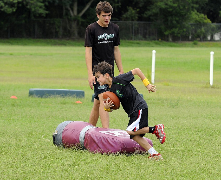 Nine-year-old Jackson Watrobsky completes a defensive tackling series.