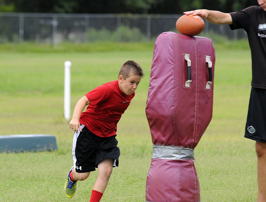 Nine-year-old Jack Meyers’ favorite part of camp was working on his tackling.