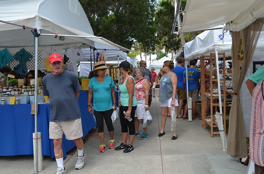 Residents and visitors shop the St. Armands Craft Festival at Circle Park.
