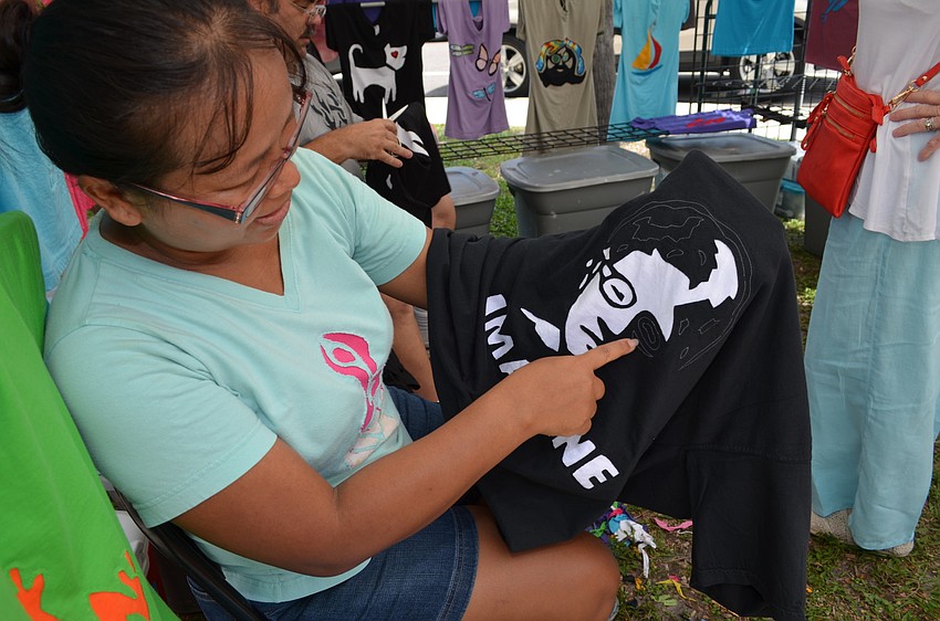 Sawi McLaughlin works on a John Lennon cutout T-shirt for S and G Designs.