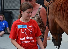 Jordan Mantone approaches Duke slowly and waits for his permission to pet him.