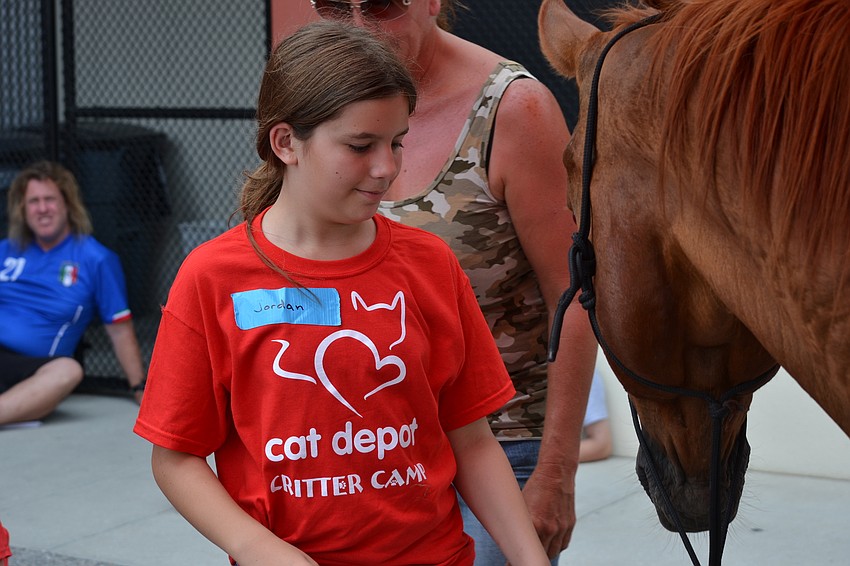 Jordan Mantone approaches Duke slowly and waits for his permission to pet him.