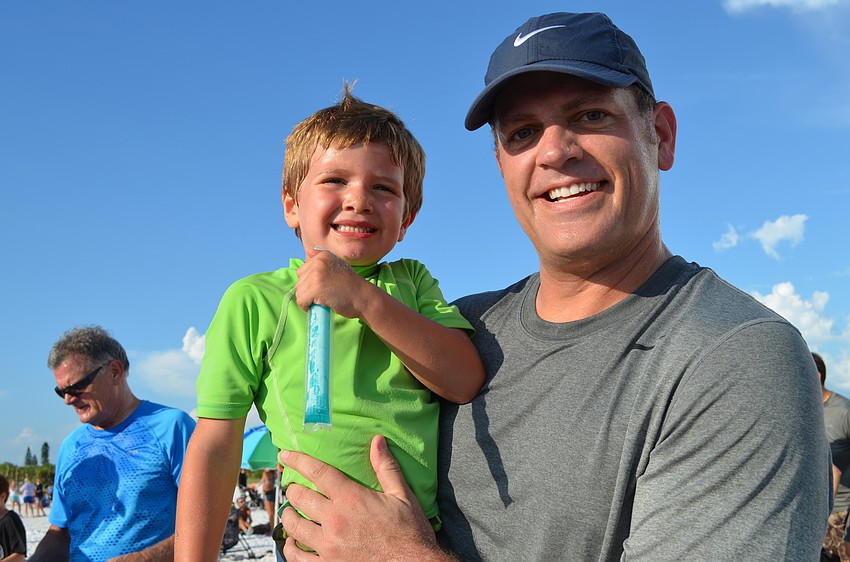 Anderson and Jonathan Angel after participating in the 1-mile beach run.