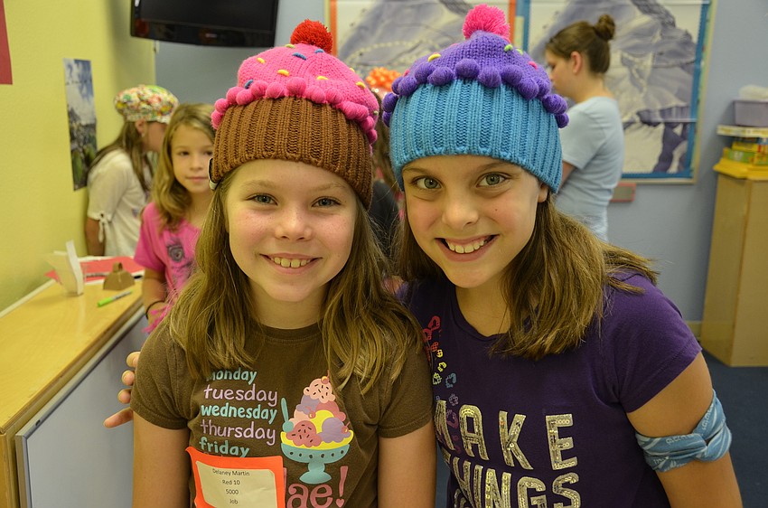 Delaney Martin, 8, and Bianca Jarvis, 11, wore their cupcake hats.