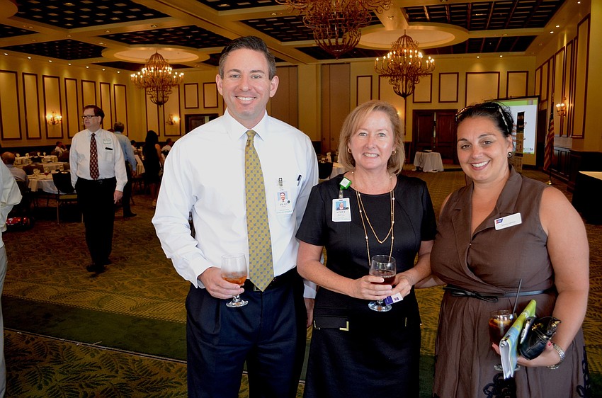 Brad Jones says cheese beside Aimee Benett and Tammy Lennox.