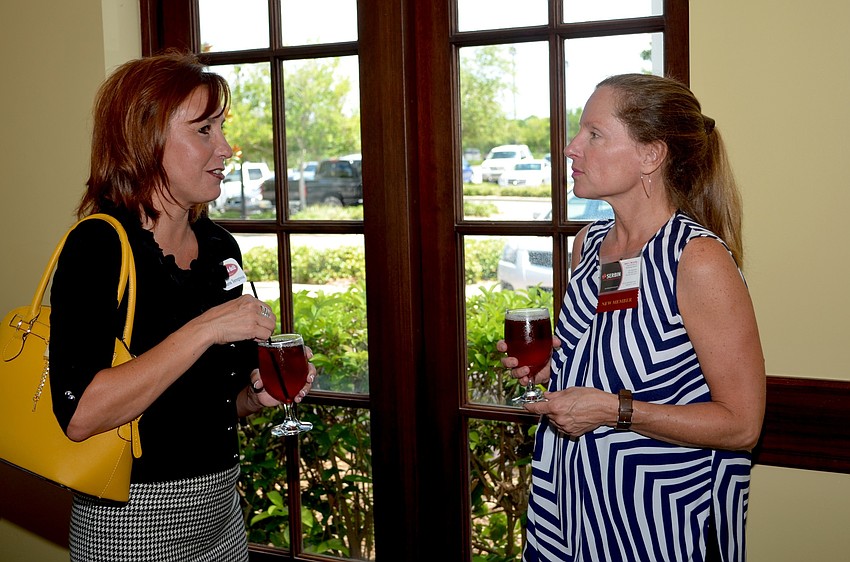 Sharon Torregrossa and Beth McCarthy enjoy cold cocktails and networking.