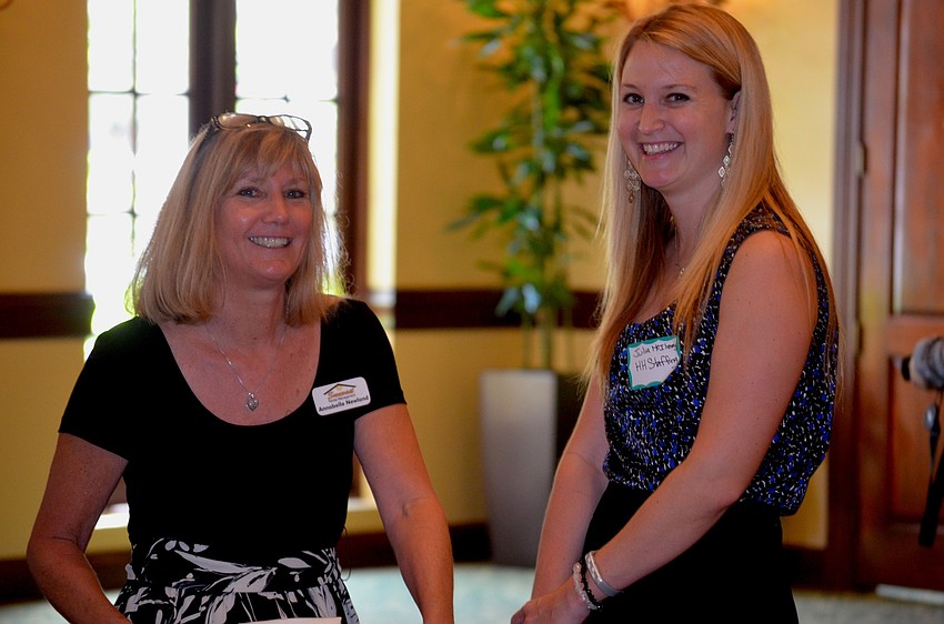 Annabelle Newland and Julia McIlrevey share stories before the presentation by Bucs C.O.O.