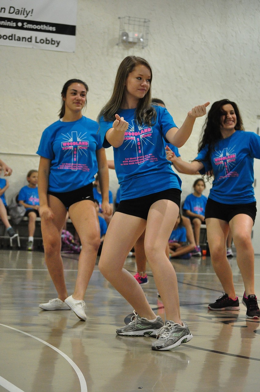 Instructor Taylor Kolbe, a freshman at Braden River High School, shows off a routine to campers and their parents.