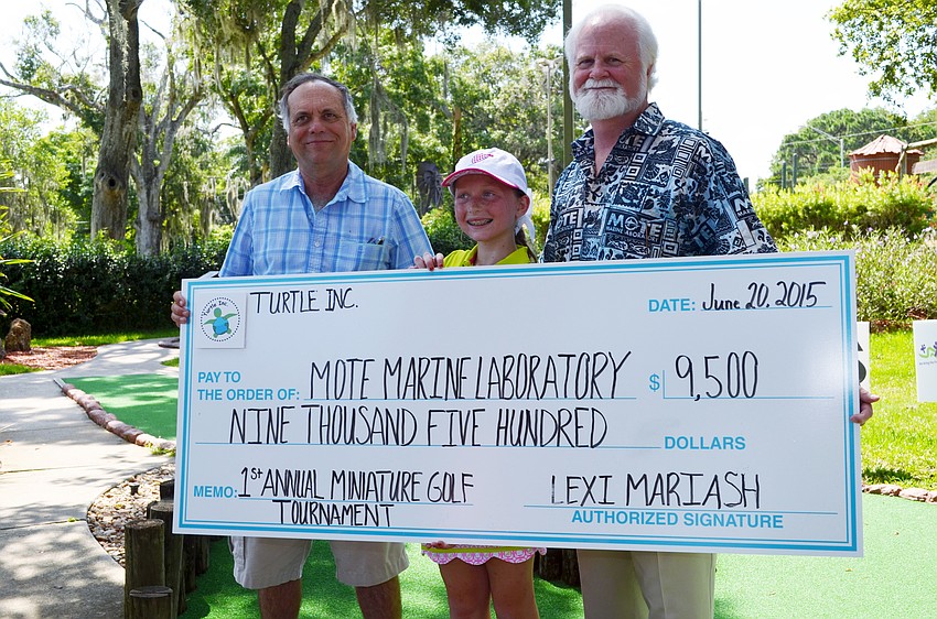 Mote Marine Laboratory & Aquarium Sea Turtle Program Manager Buddy Powell, Turtle Inc. Founder Lexi Mariash and Mote President & CEO Michael Crosby.