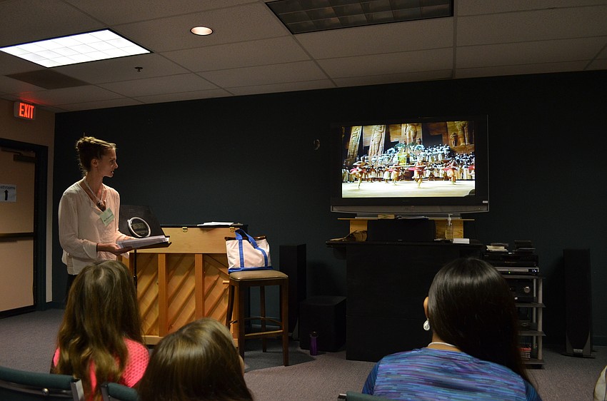 The student watch a recorded production of the 1989 Metropolitan Opera production of 
