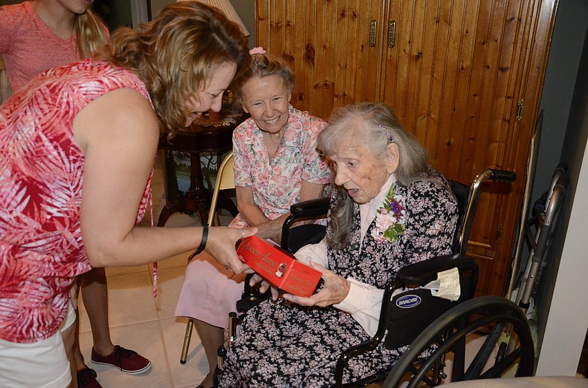 Gloria Shirey gave Edna Strode a box of Queen Lane chocolate covered cherries, because Strode used to pack candy for the company.