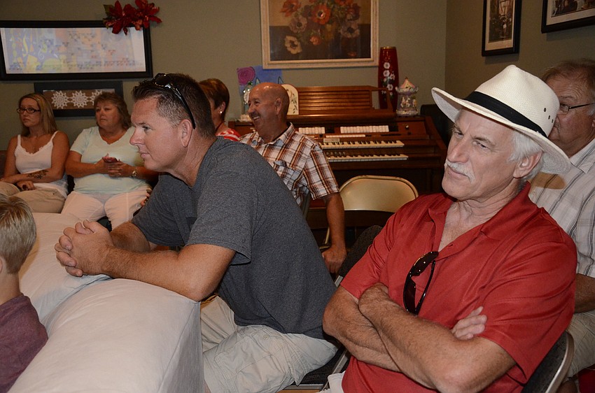 Joe Corkins and Ron Hamiliton listen to their grandma's performance.