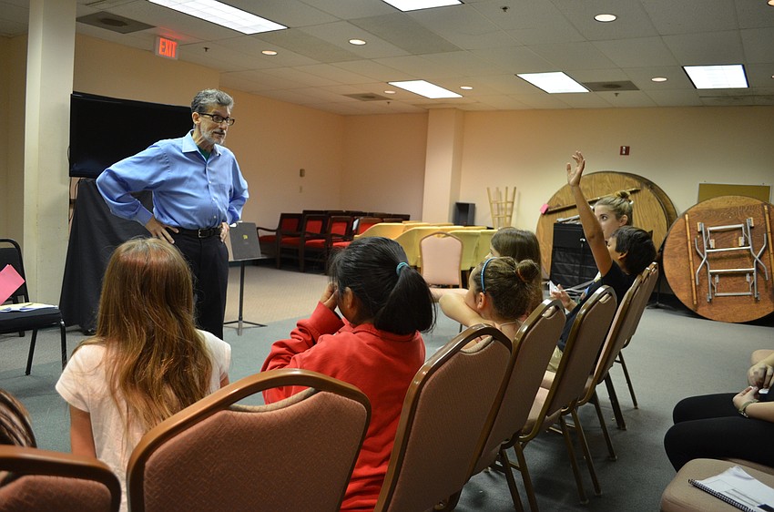 The director of artistic administration Greg Trupiano teaches the students how to create their own opera.