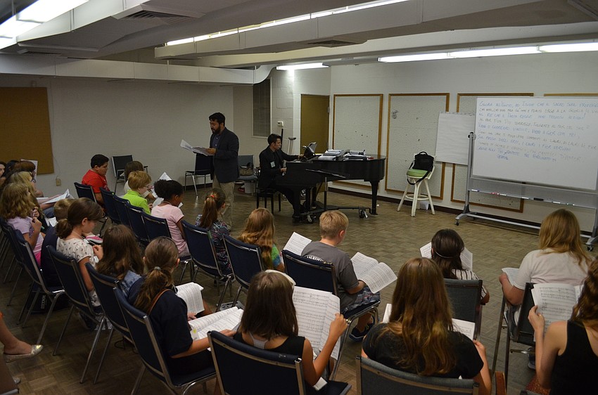 In a different group of older students, Maestro Jesse Martins works through songs from the youth opera's production of 