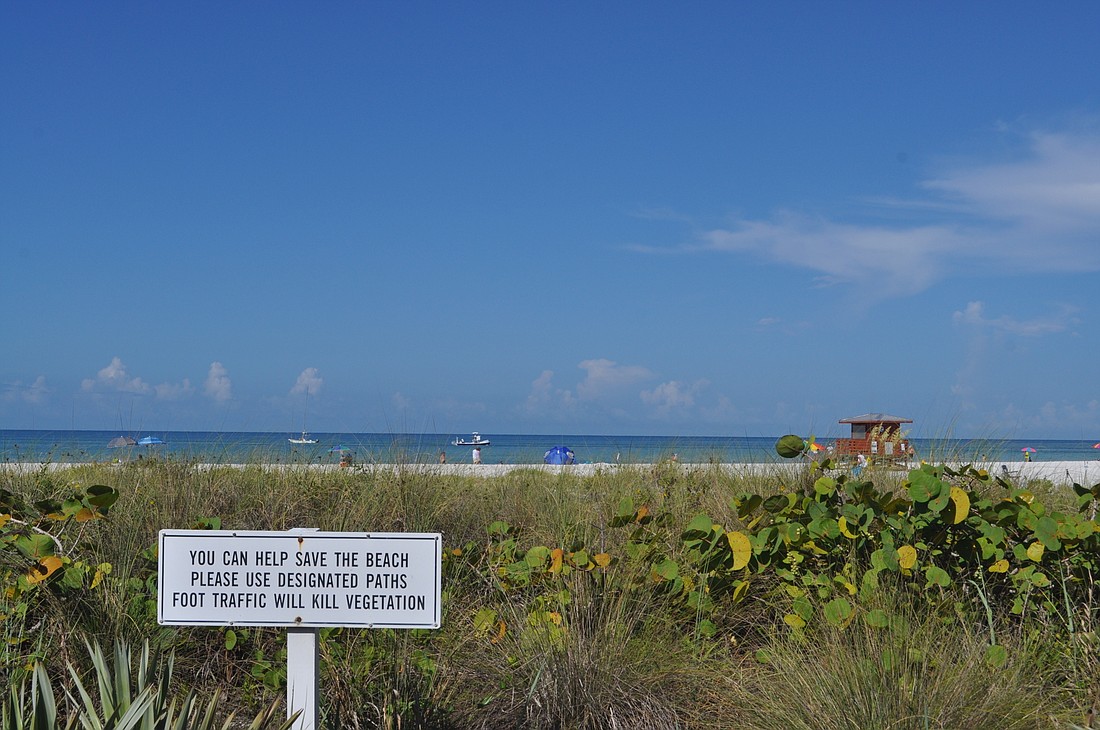 The city and county hope additional signage can help prevent damage to the dunes at Lido Beach.