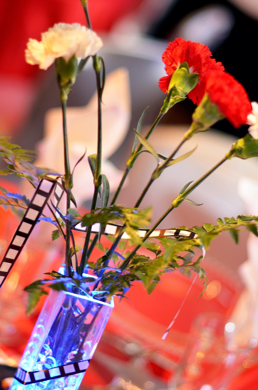 Motion picture film negatives were wrapped into the table centerpieces at Artist Series Concerts of Sarasota’s ‘Hooray for Hollywood’ event.
