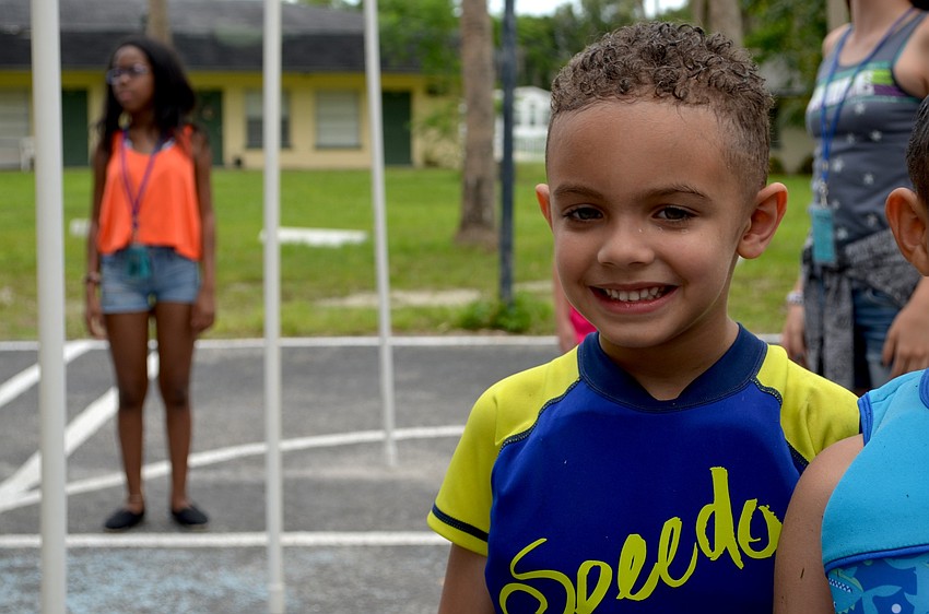 John-Michael Paredes takes a break from an outdoor game.