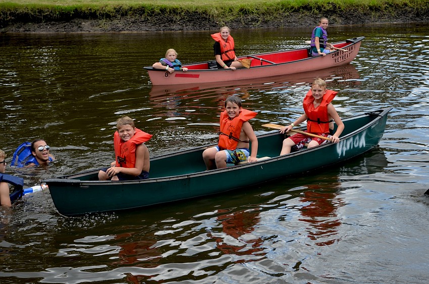Dylan Young, Chaz Sylvester and Peyton Britt say cheese before heading out on the water in their canoe.
